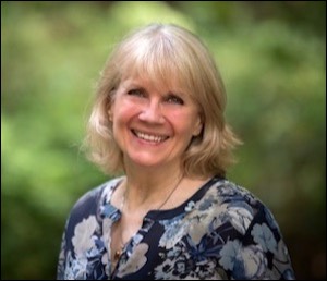 Woman smiling with green background