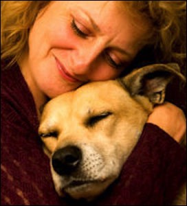 Woman cradling dog