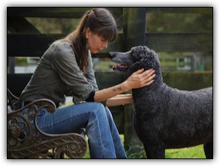 Woman listening to dog